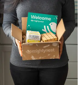 holding mightyfix box with card